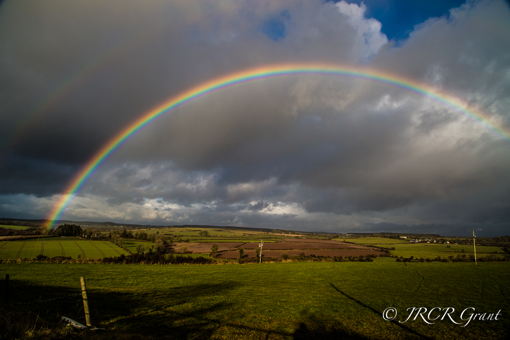 A rainbow firmly plants itself in the fields of East Cork