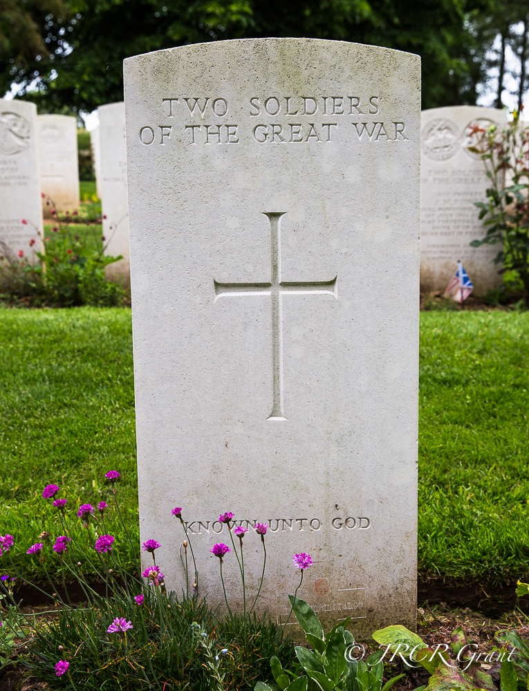 A head stone marks the grave of two unknown soldiers of the great war