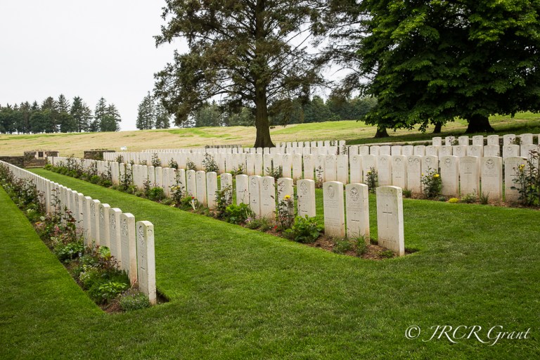 Y-Trench Cemetery with the scarred battlefield behind