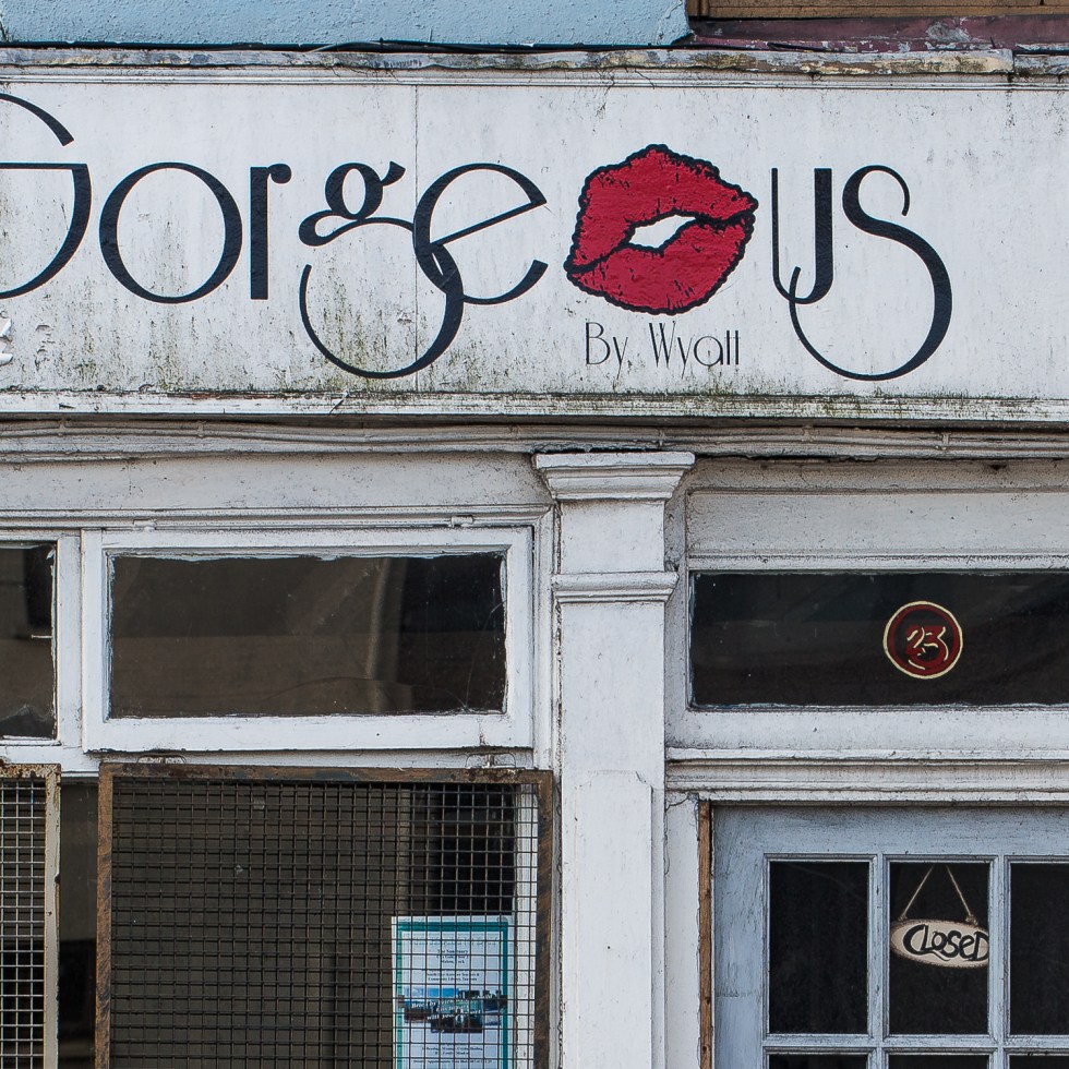 A run down beauty boutique has the ironic name of Gorgeous.