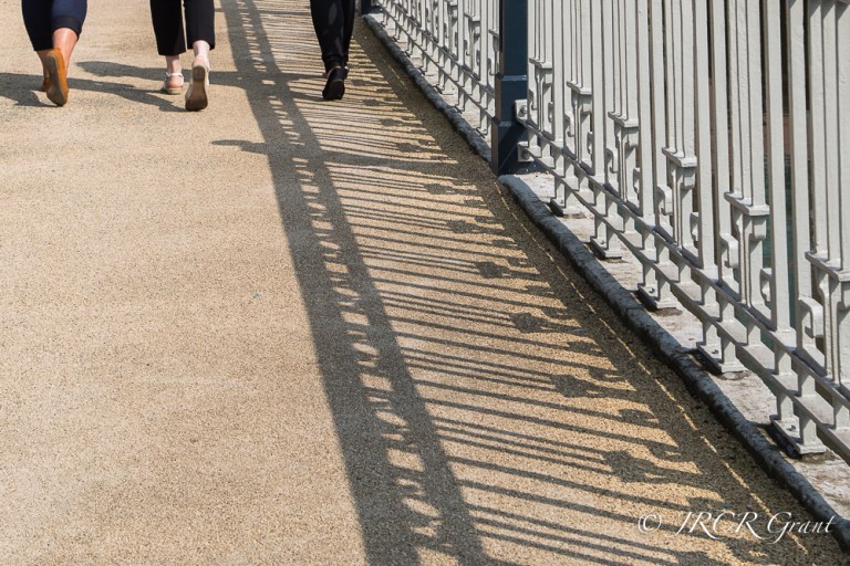 3 ladies cross Brian Boru bridge in Cork City centre