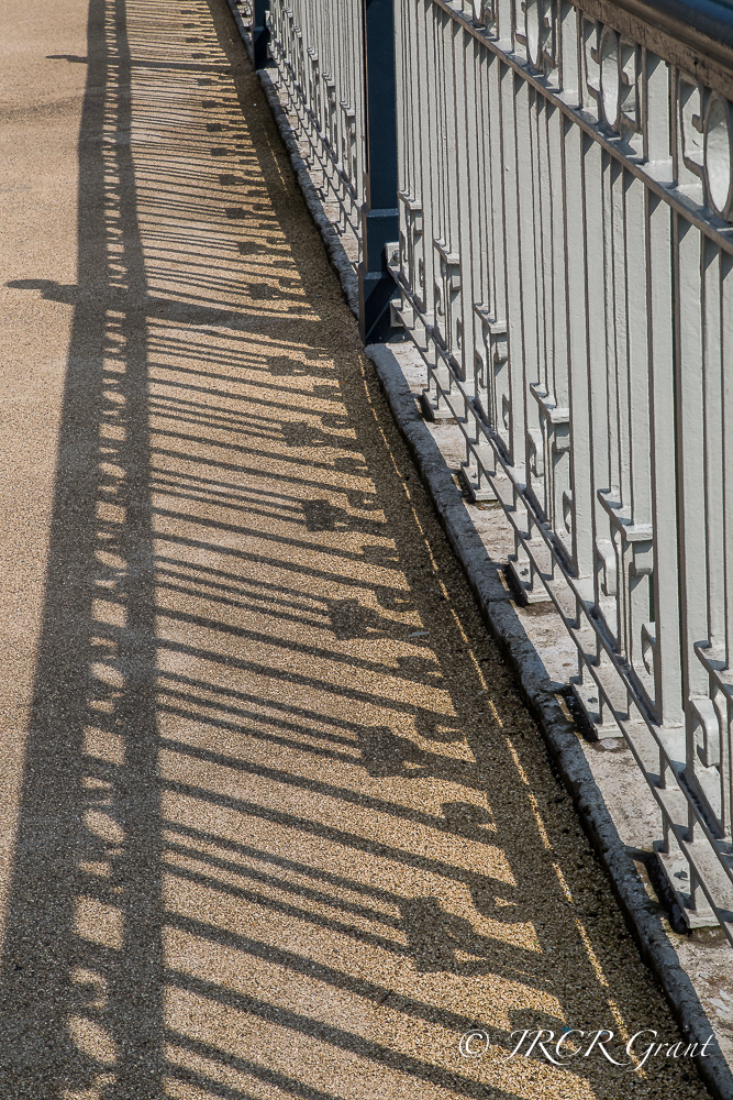 Railings of Brian Boru Bridge in Cork get enhanced by their shadows