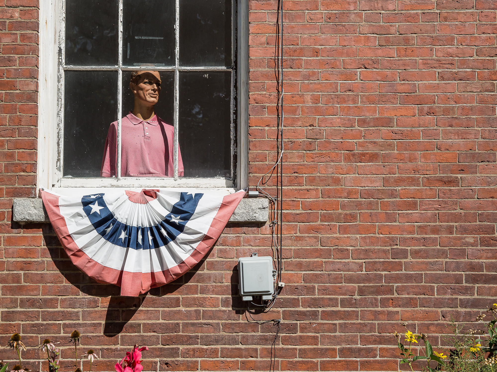 Dummy in Chester, Vermont stares out of a window