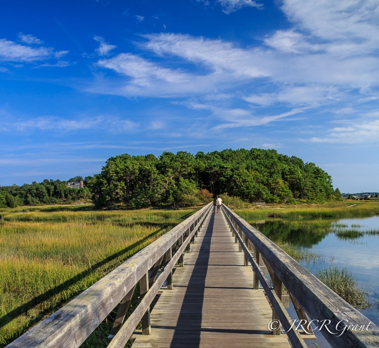 A wooden bridge links the village of Wellfleet, Cape Cod to the other side of the estuary