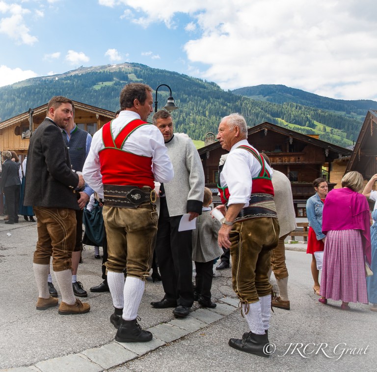 Men in traditional Austrian gear in the village of Alpbach