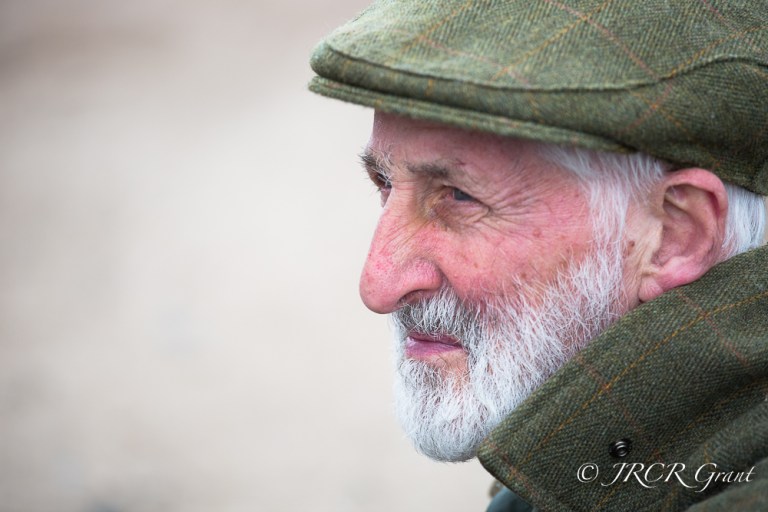 An experienced falconer assesses the conditions, silence the key
