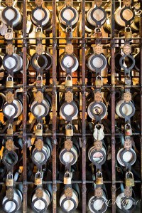 The steins of regulars are stored in racks in a Munich beer hall, each stein being guarded by a padlocked cage
