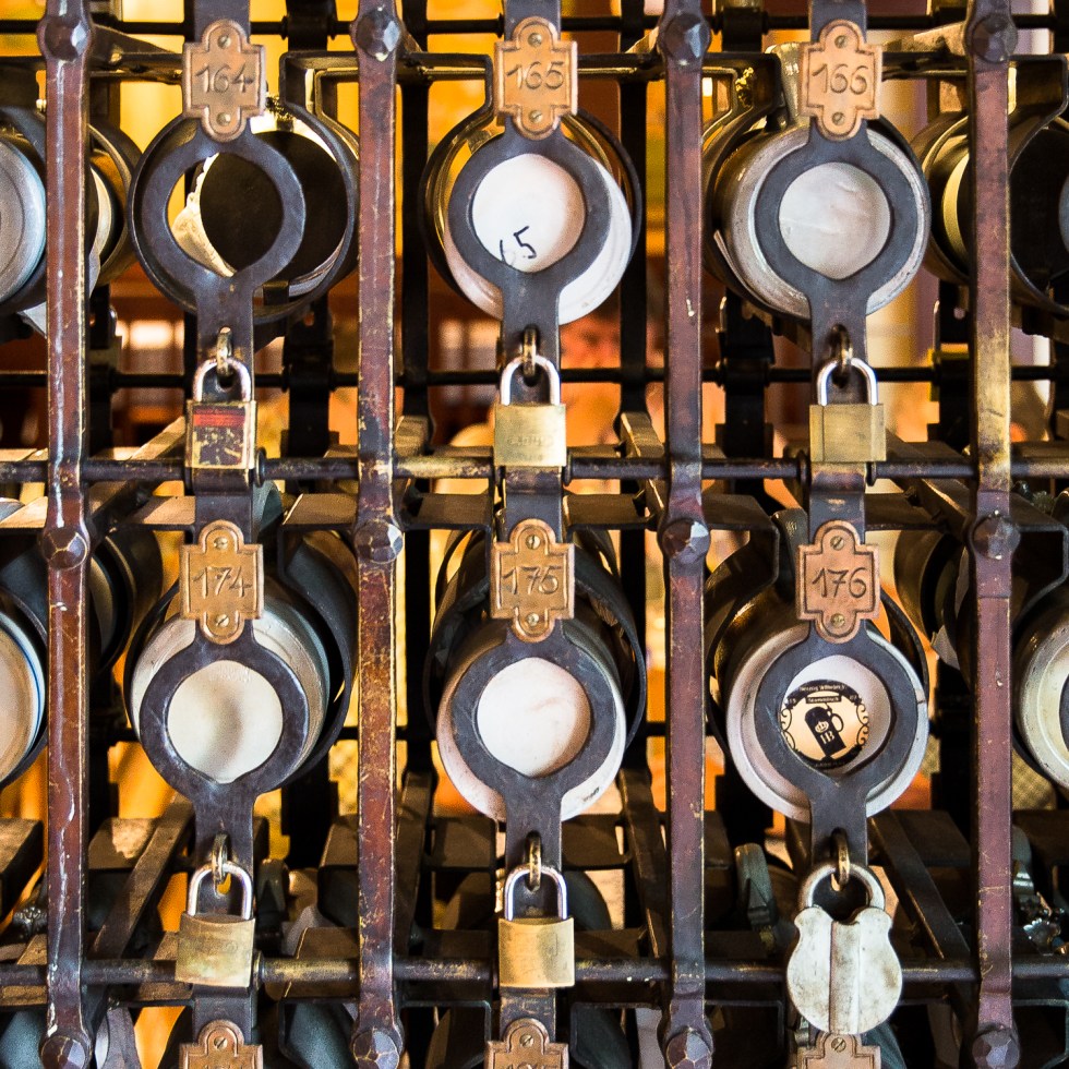 Beer steins under lock and key in a beer hall, munich, bavaria, germany