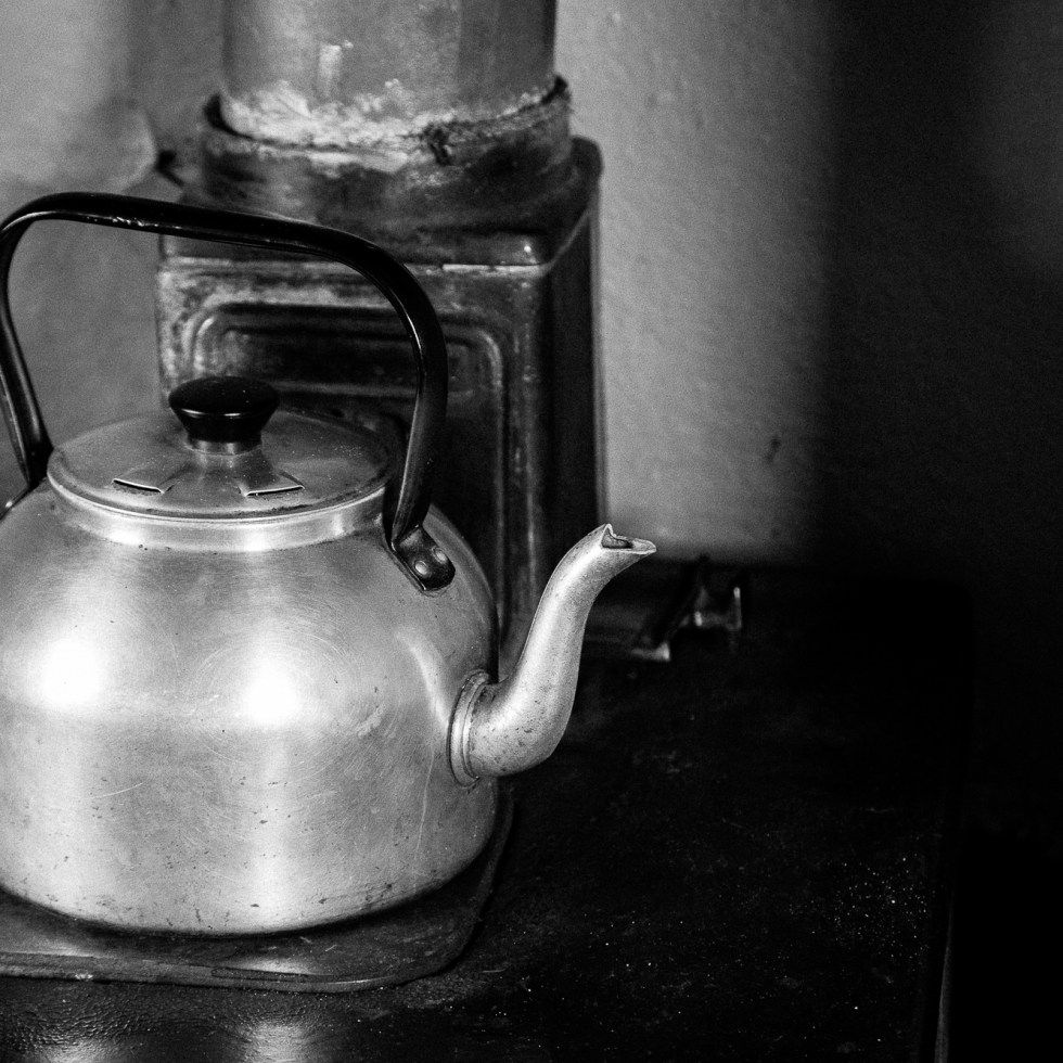An old beloved kettle still pouring hot water to make a perfect cuppa