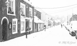 Longboats and the Blackrock Road in Ballintemple, Cork as the snow of 2018 fell