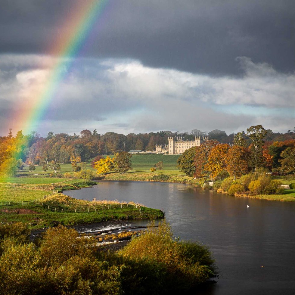 Floors Castle flanked by a rainbow