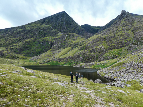 The peak of Carrauntoohil, visible for a fleeting glance, can be seen above Lough Gouragh.