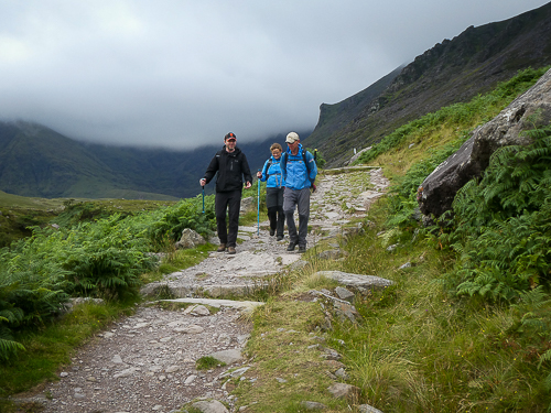 Hikers looking spritely as they reach the end of a hike having scaled Carrauntoohil