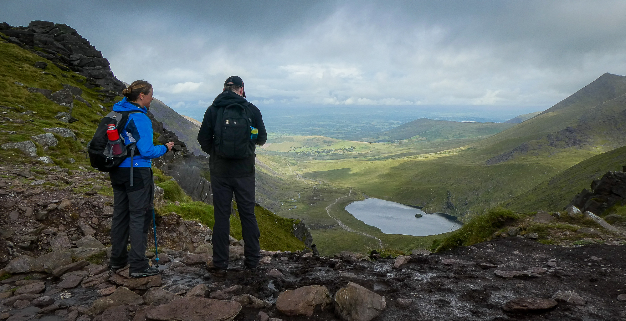 Two hikers take in the view from the top of the Devil's Ladder on Carrauntoohil