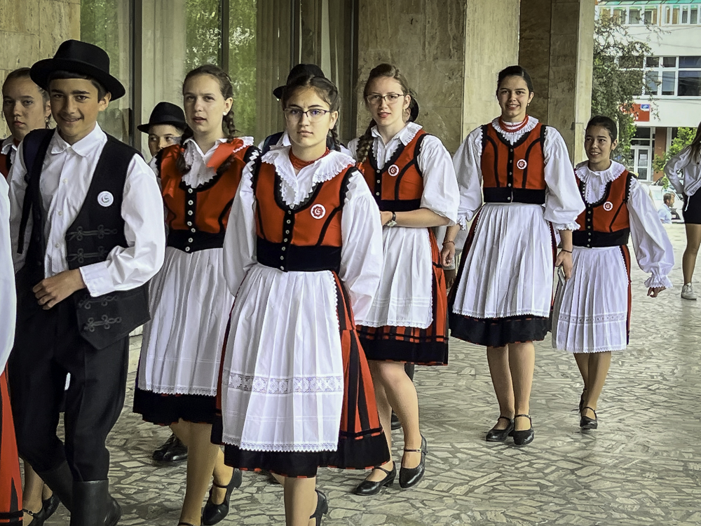 A traditional folk dance group take to the stage in Csékszereda, Romania