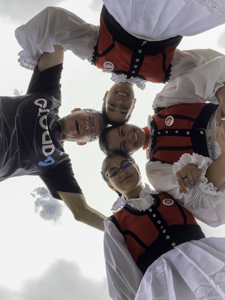 the three young ladies and the author gather for a photograph, the phone lying on the floor